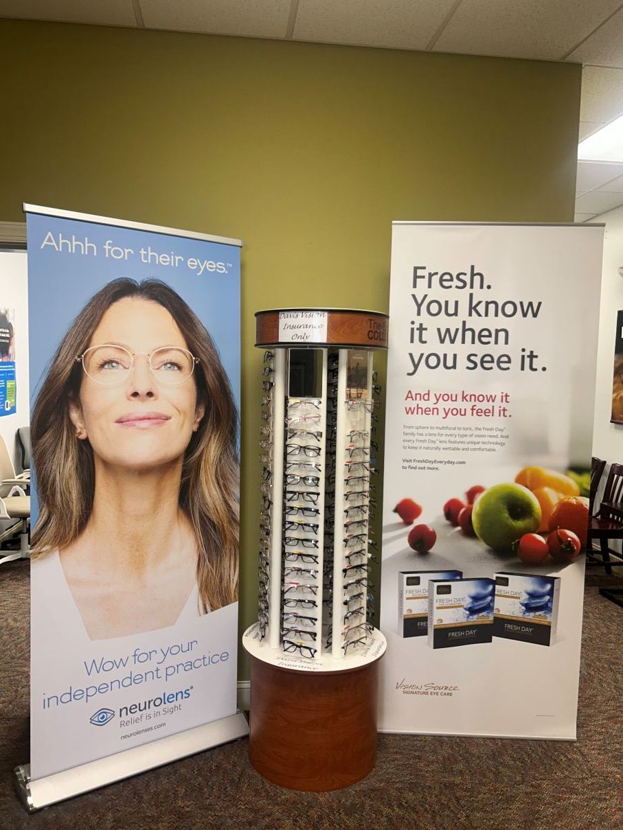 Two promotional banners and a cylindrical display in a hallway, one with a portrait and one with fruit and the text “Fresh. You know it when you see it.” in Eastover, NC.