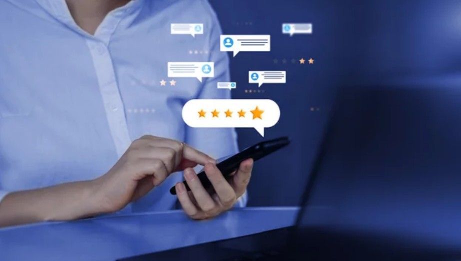 A person using a smartphone with digital icons for customer service and a five-star rating floating above the screen.