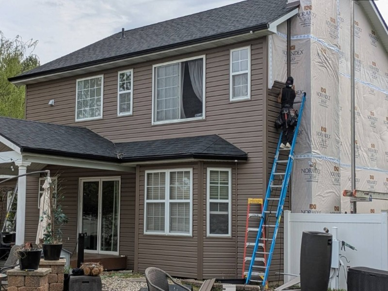Construction crew working on roof replacement