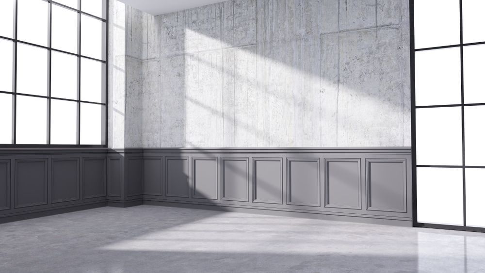 An Empty Room with a Lot of Windows and a Concrete wall — Hunter Valley Tile Mart in Rutherford, NSW