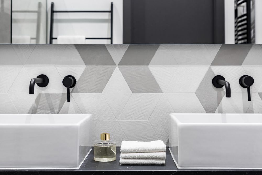 A Bathroom with two Sinks and a mirror — Hunter Valley Tile Mart in Thornton, NSW