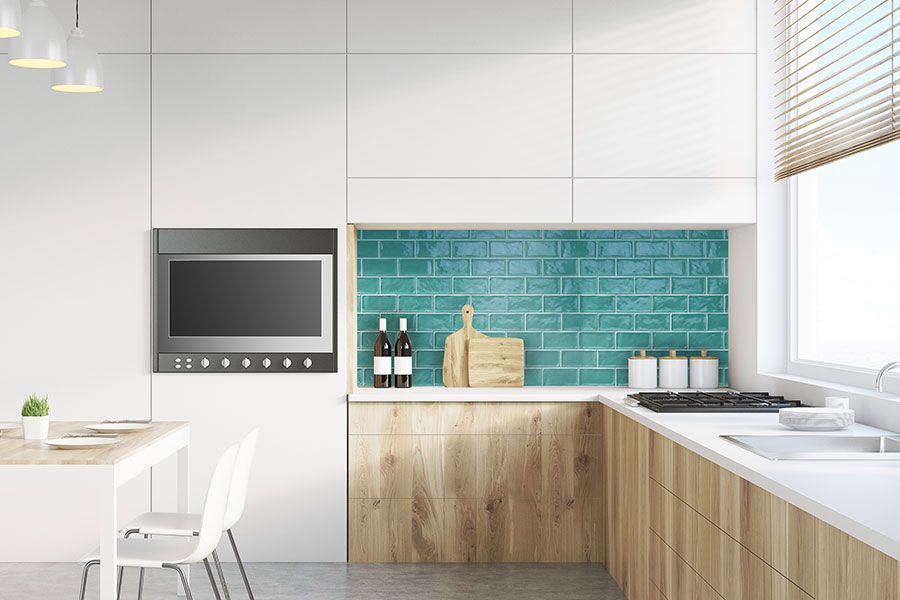 Spacious Kitchen With Green Brick Tile Wall — Hunter Valley Tile Mart in Rutherford, NSW