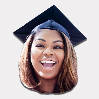 Smiling graduate in a navy cap and gown, cropped portrait on a white background