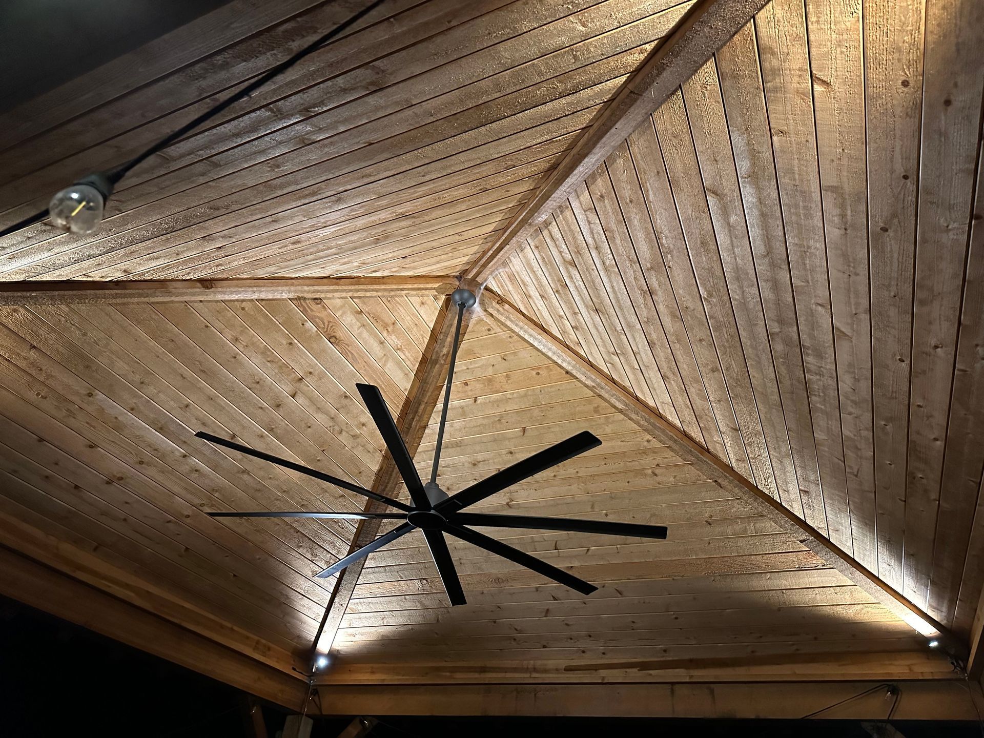 Nighttime lighting in outdoor covering with fan