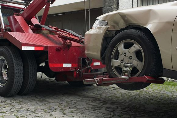Towing Away a Crashed Car — Panama City, FL — Garrett’s Automotive Service