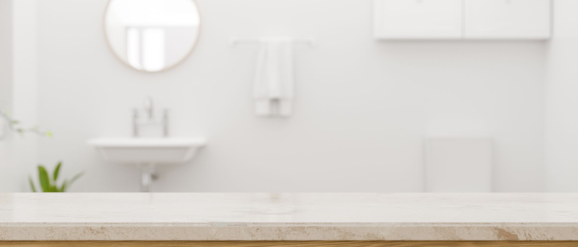 A blurred image of a bathroom with a sink and mirror.