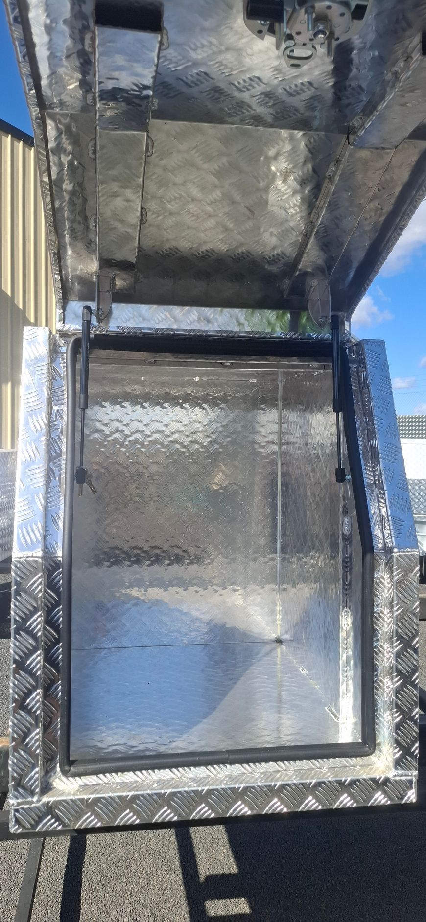 Open metal storage box with diamond plate pattern — Towform Trailers in Brocklehurst, NSW