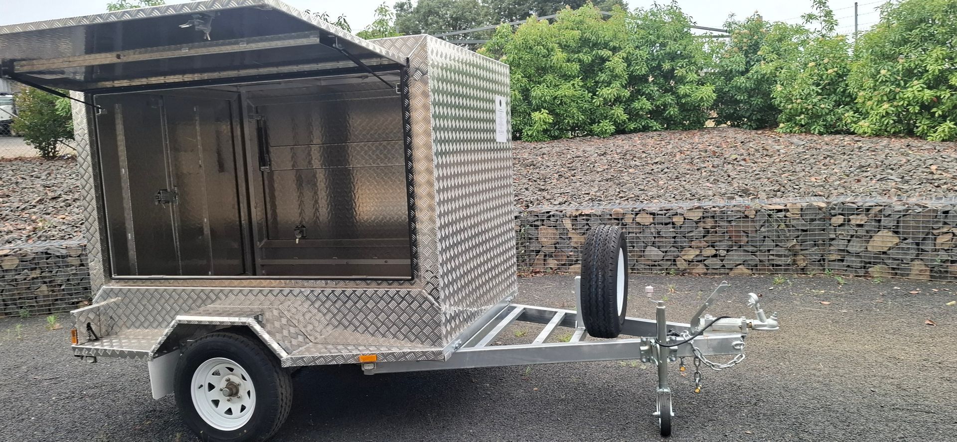 Silver Utility Trailer With Enclosed Storage, Parked on Gravel — Towform Trailers in Brocklehurst, NSW