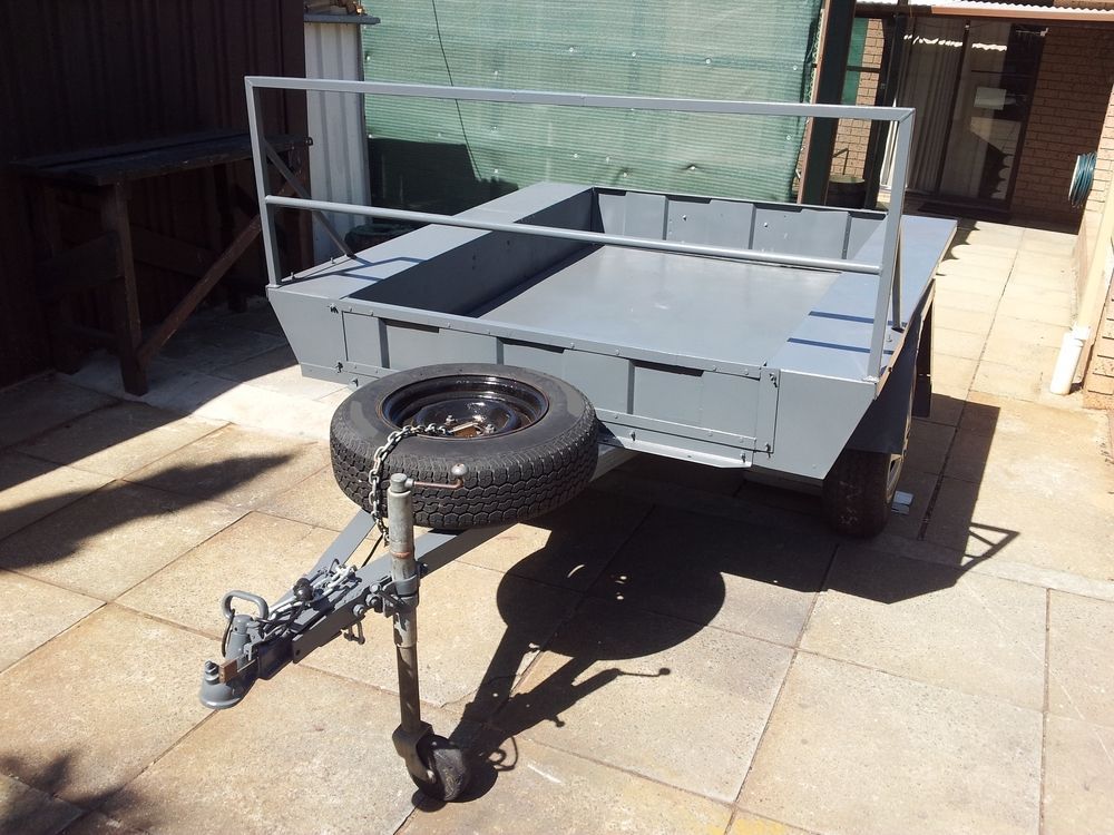 Gray Utility Trailer With Spare Tire, Safety Railing — Towform Trailers in Brocklehurst, NSW