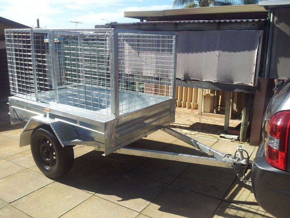 Metal Utility Trailer With Wire Mesh Sides, Parked on Pavers — Towform Trailers in Brocklehurst, NSW