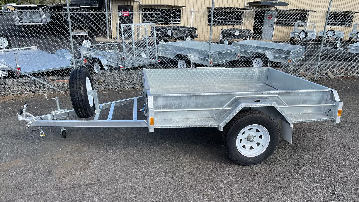 Galvanized Steel Utility Trailer Parked On A Paved Lot — Towform Trailers in Walgett, NSW