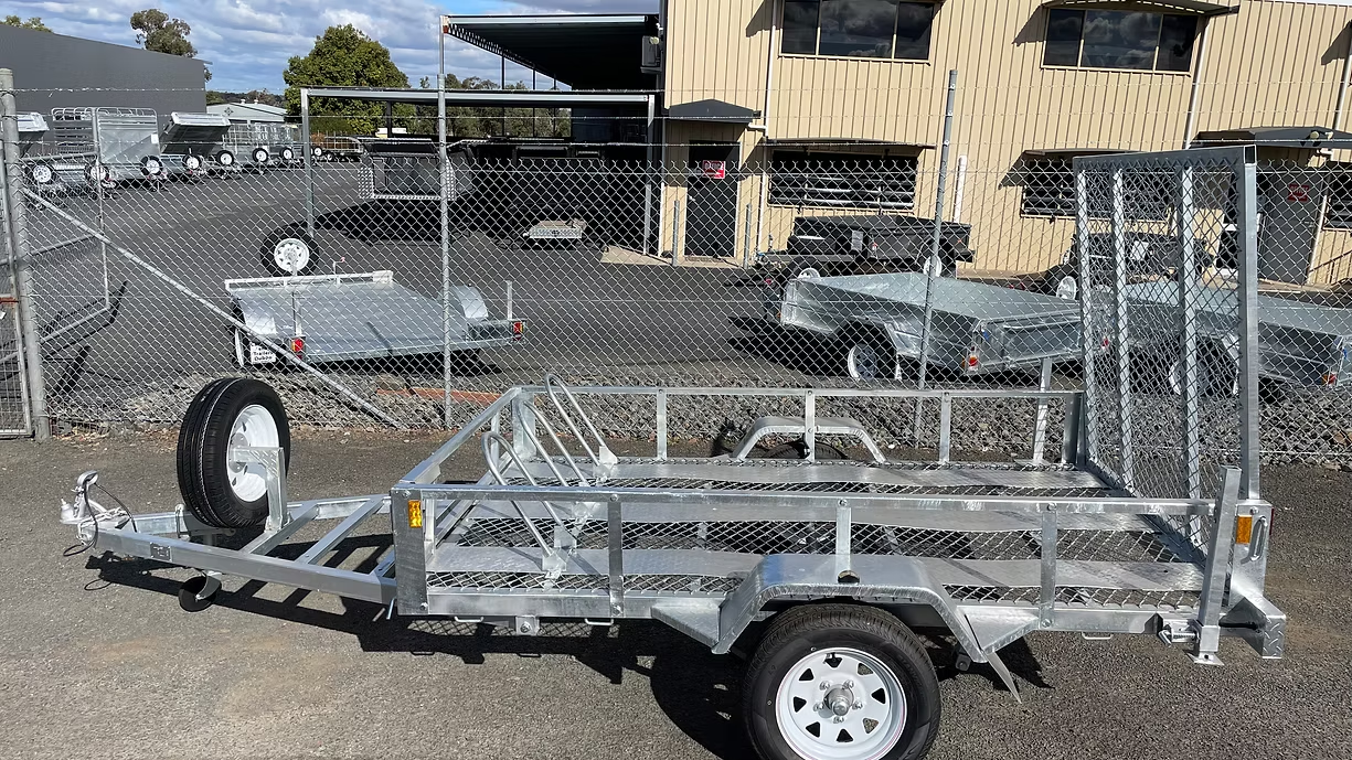 A Galvanized Metal Utility Trailer With a Spare Tire — Towform Trailers in Brocklehurst, NSW