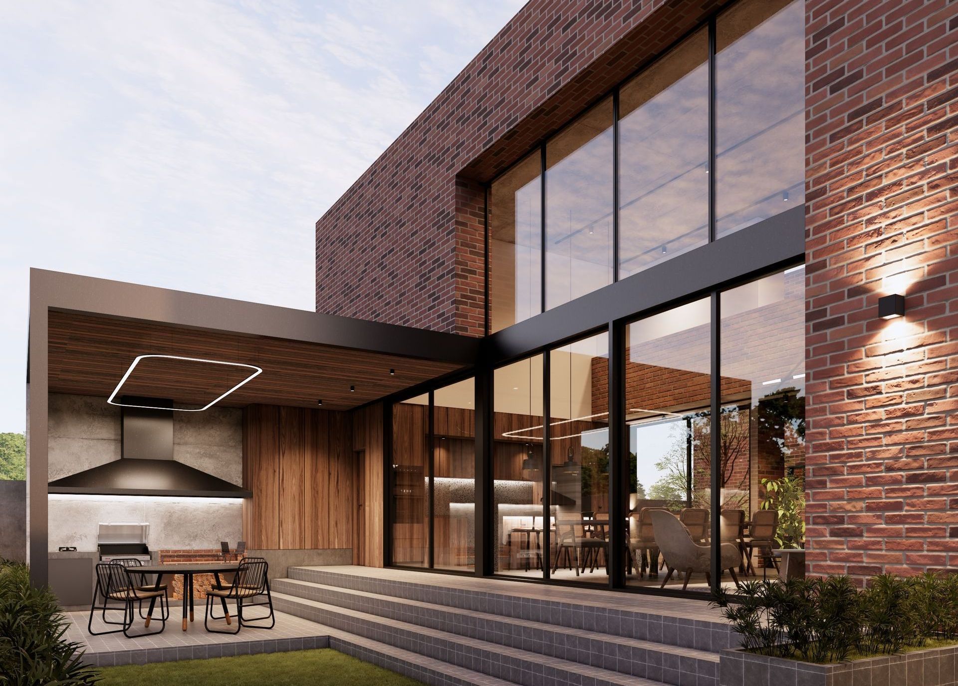 Área de terraza asador  en diseño industrial con ladrillos, concreto aparente y doble altura