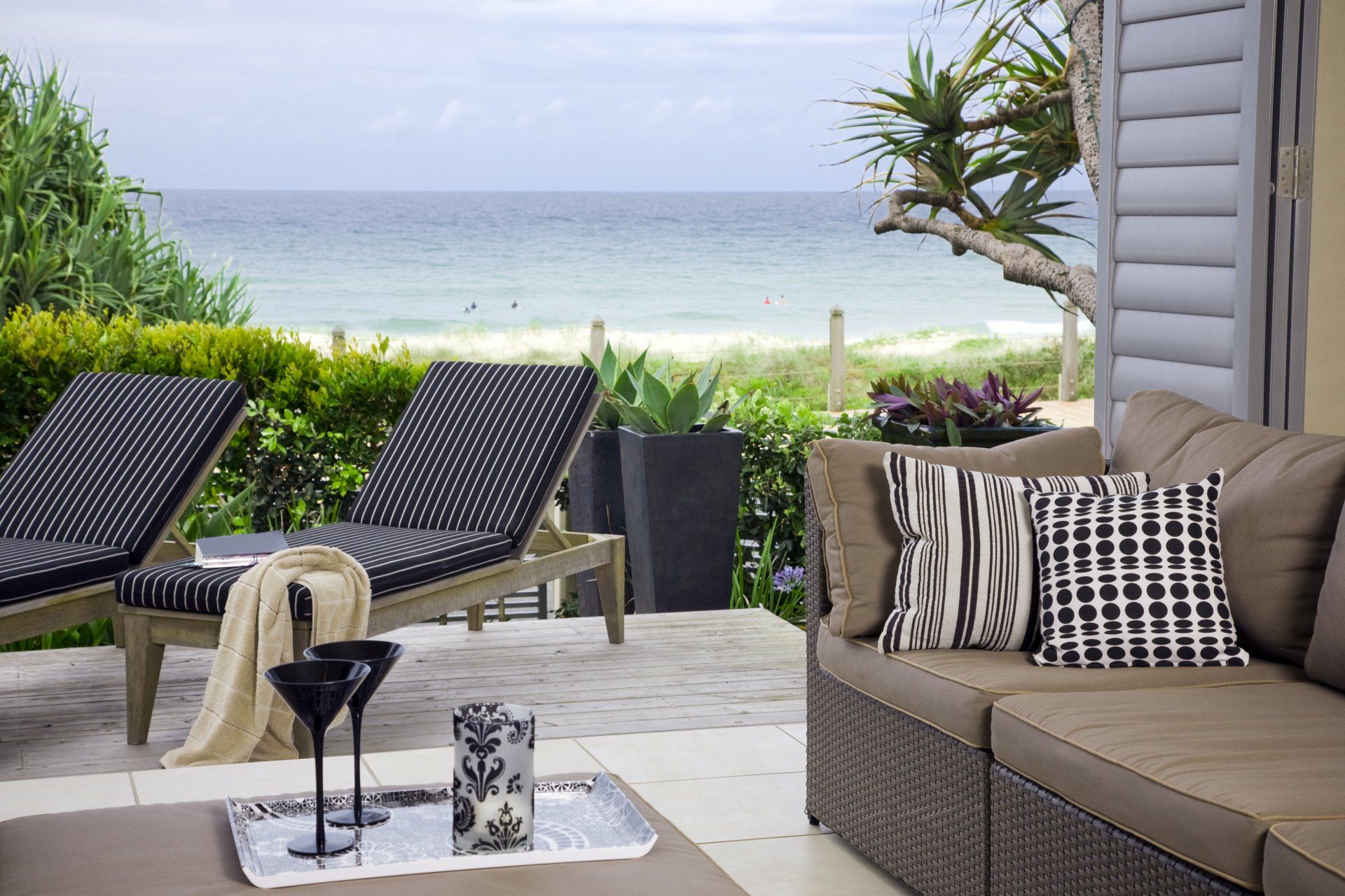 Couch and Sun Chair on patio Facing the Beach — A. Webber Building in Vincentia, NSW