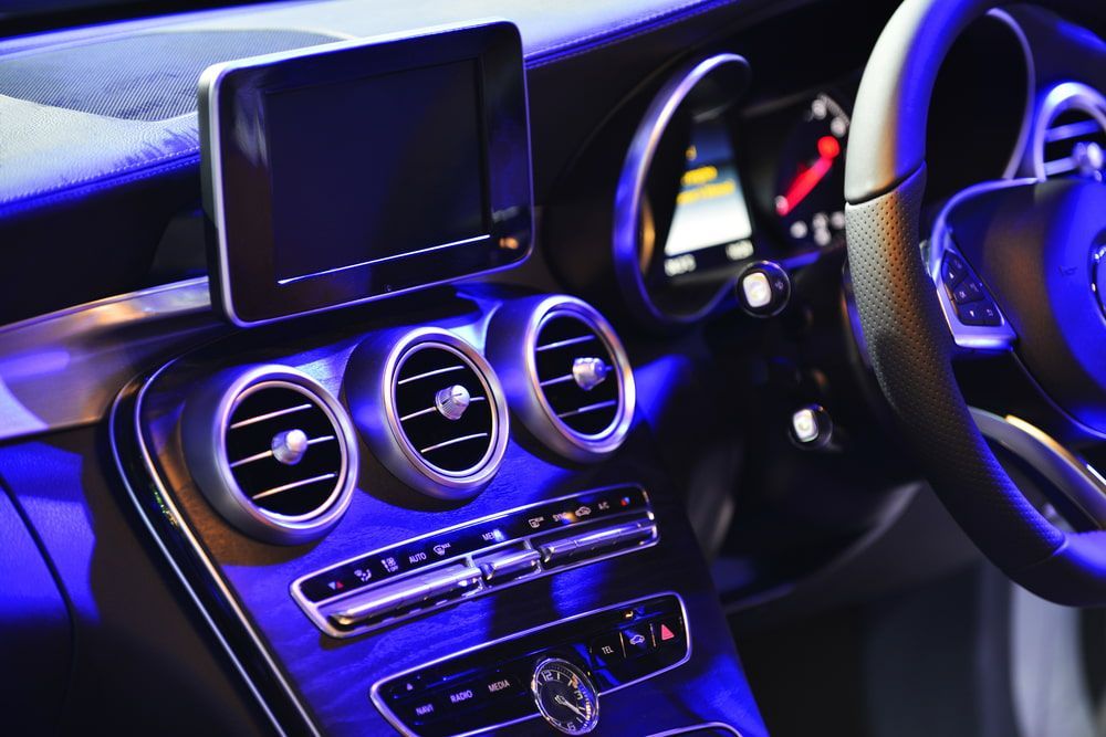 The Interior of a Car With a Blue Light on the Dashboard — Bowen Mechanical & Haulage in Bowen, QLD