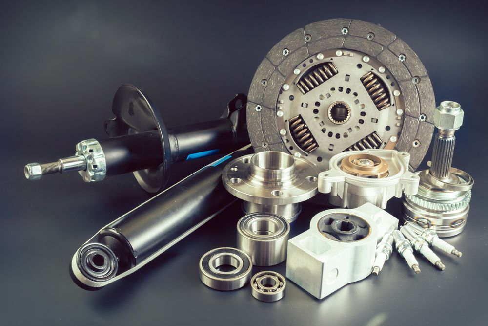 There Are Many Different Types of Car Parts on the Table — Bowen Mechanical & Haulage in Bowen, QLD