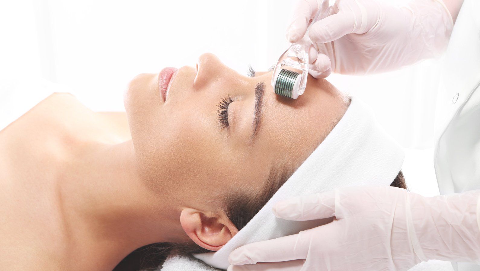 Microneedling treatment on client