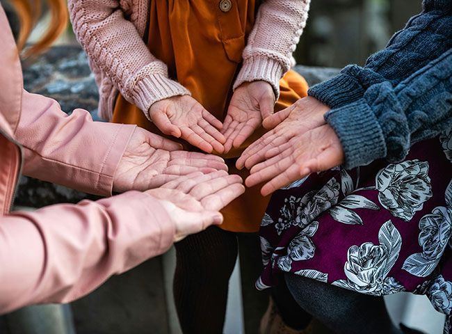 women showing hands of support