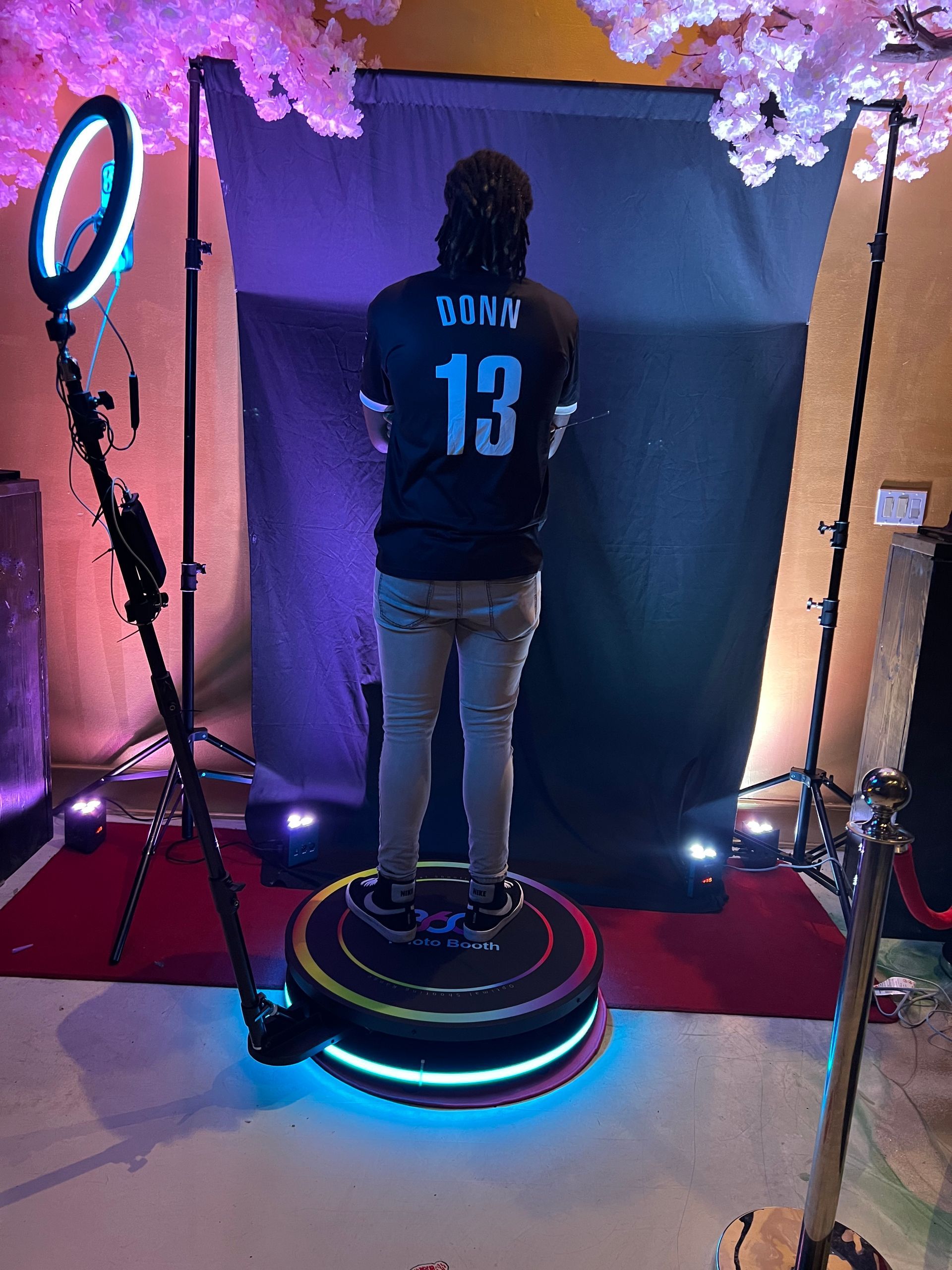 A person wearing a black shirt with the number 13 on it