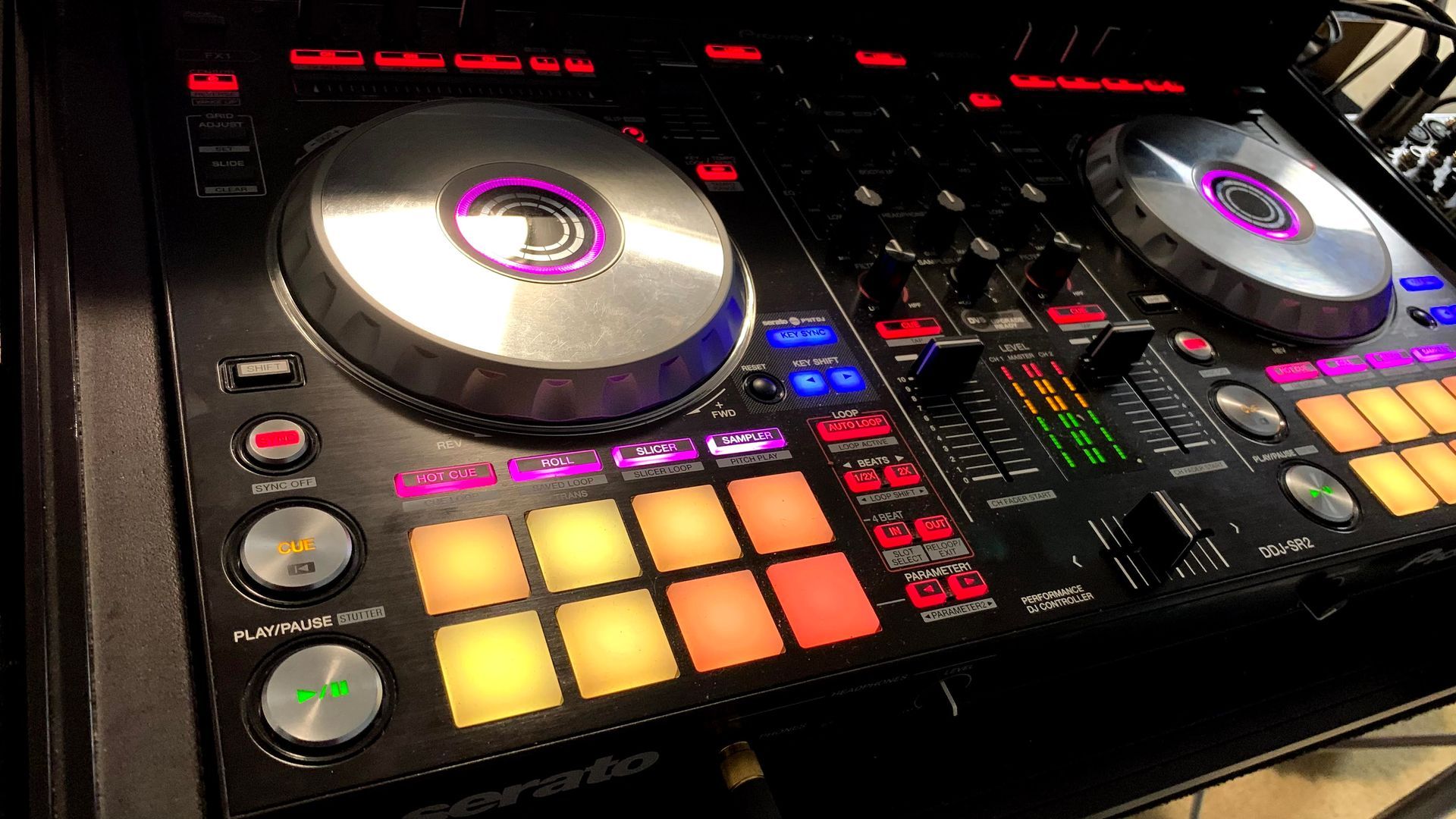 A dj controller is sitting on top of a table.