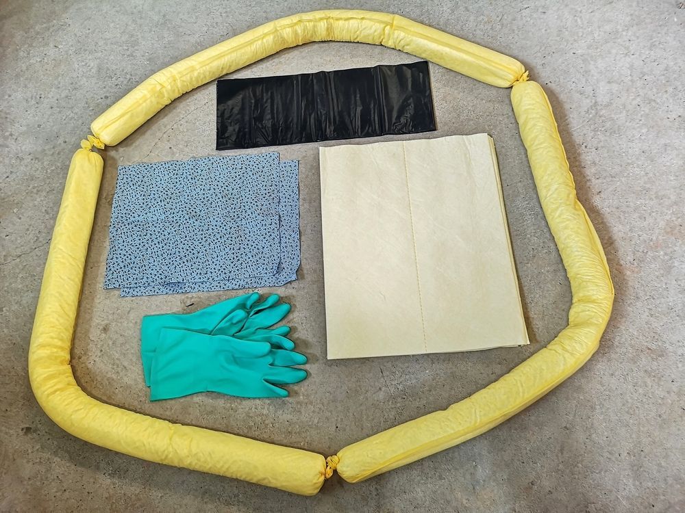 A Circle of Yellow Tubes With Gloves and Other Items in It — Envirokleen Solutions In Slade Point, QLD