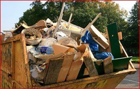  A skip filled to the brim with construction waste