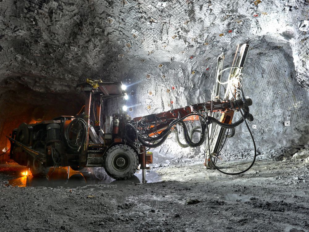 A Tractor Is Driving Through a Tunnel in A Mine — PBC Compliancing Pty Ltd in Moranbah, QLD