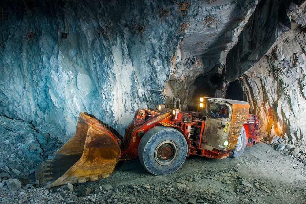 Orange Mining Loader in An Underground Tunnel — PBC Compliancing in Mackay, QLD