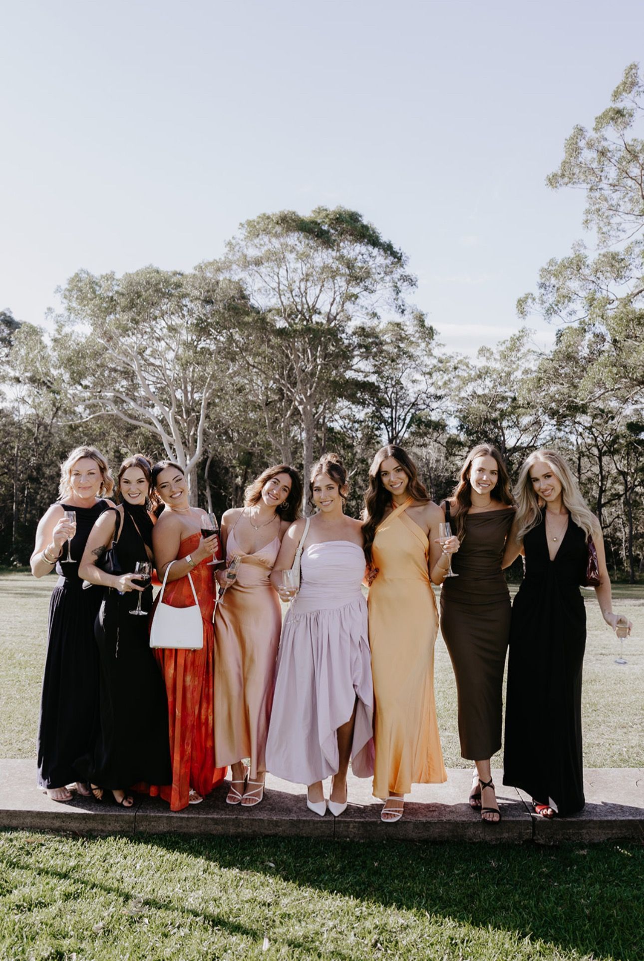 Blonde Hair Smiling with Black Dress — Balayage in Bulli NSW