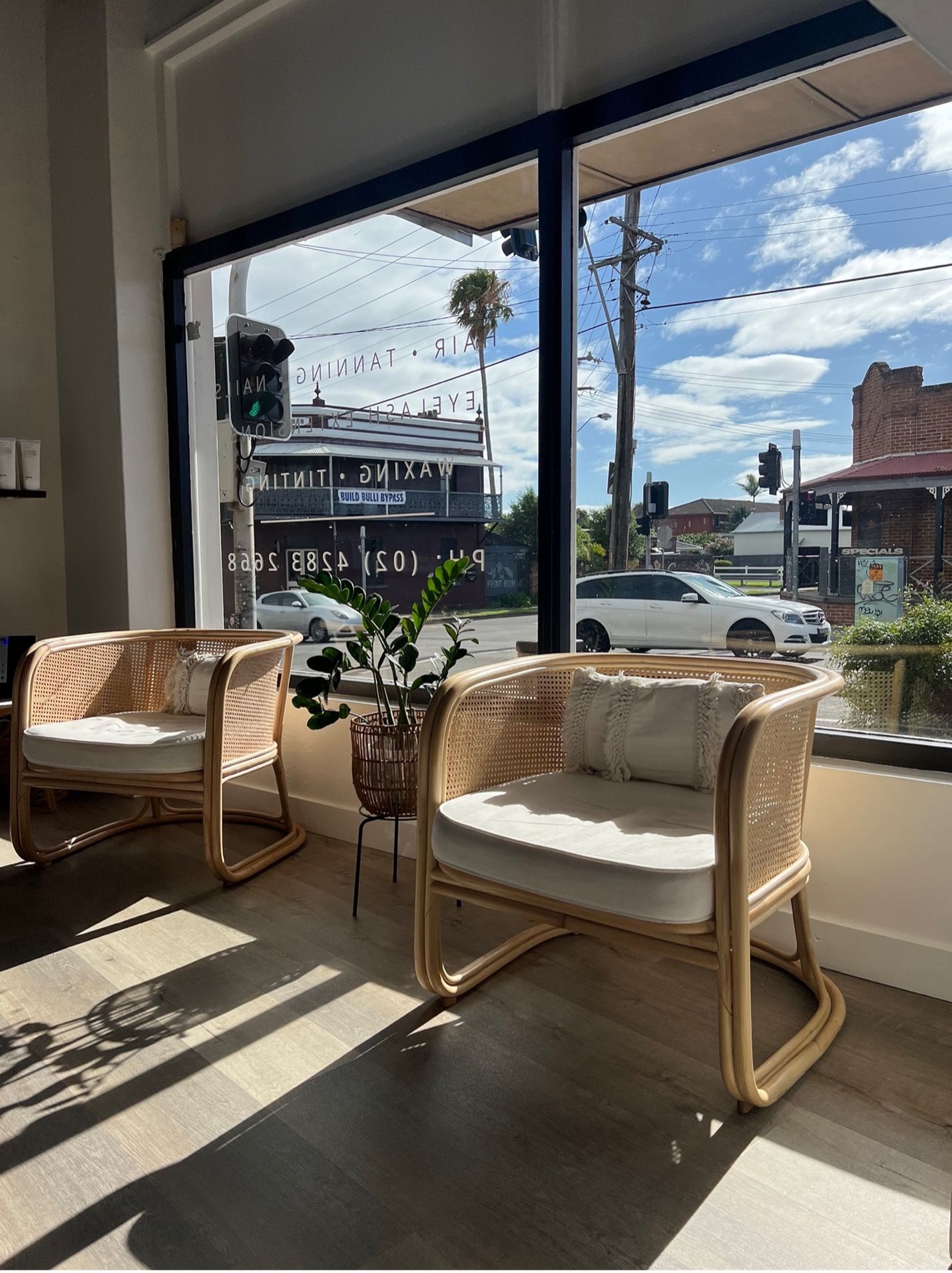 Woman Smiling while Hair Styling — Balayage in Bulli NSW