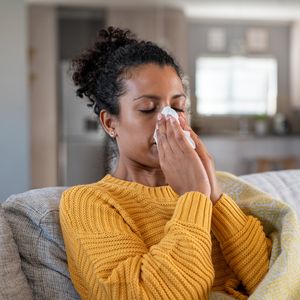 woman blowing nose