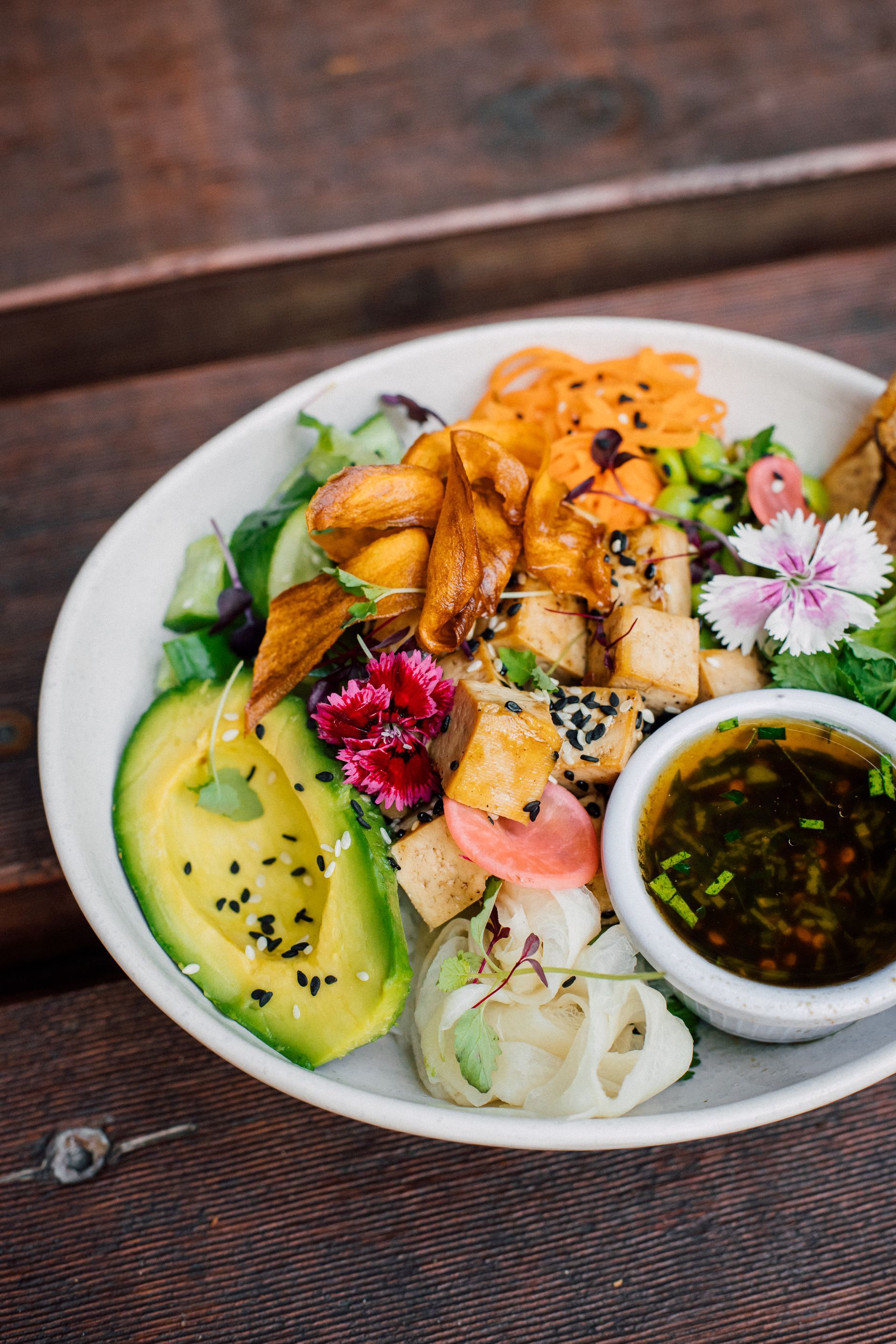 A close up of a bowl of food on a table.