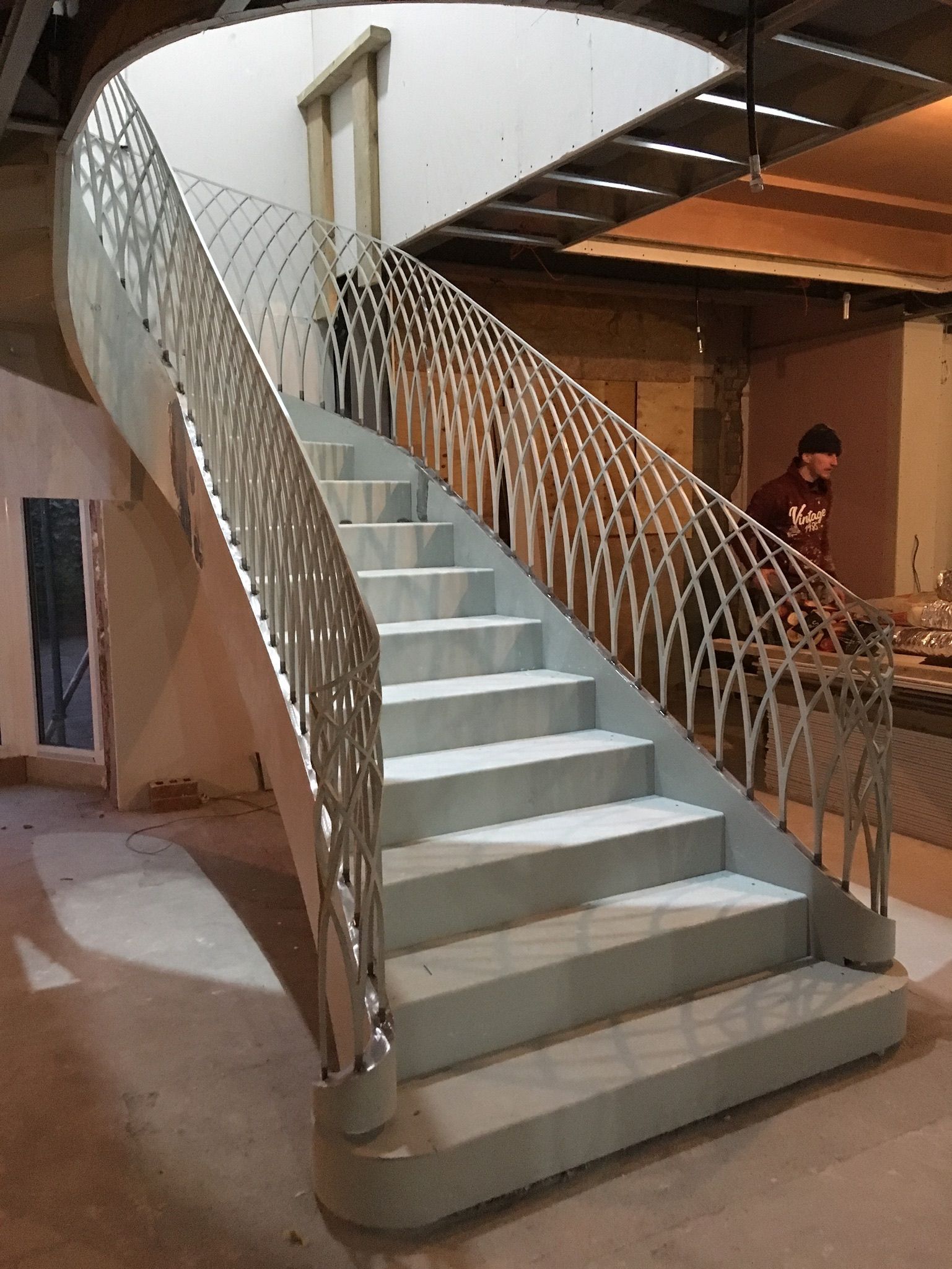 Helical staircase with lasercut steel balustrade – bespoke fabrication by Martinelli Metalworks London