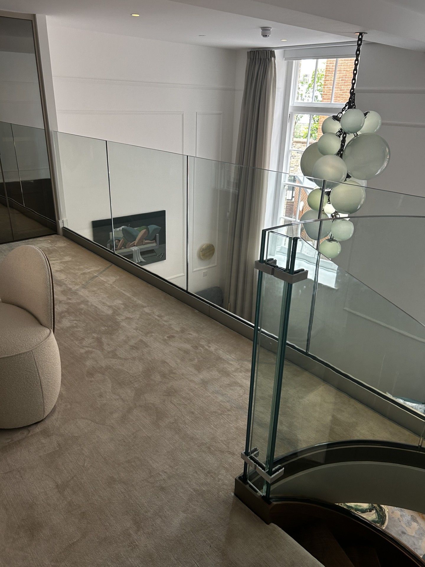 Modern staircase with metal handrail and glass balustrade – Kensington project