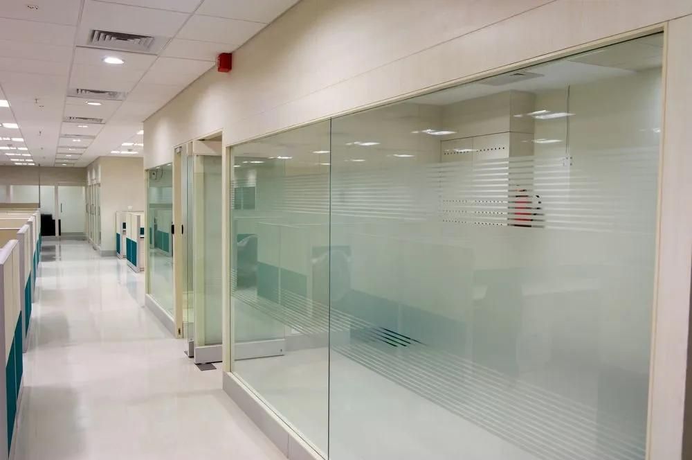 A Conference Room with A Glass Door and A Carpeted Floor — Solarmaster in Murarrie, QLD