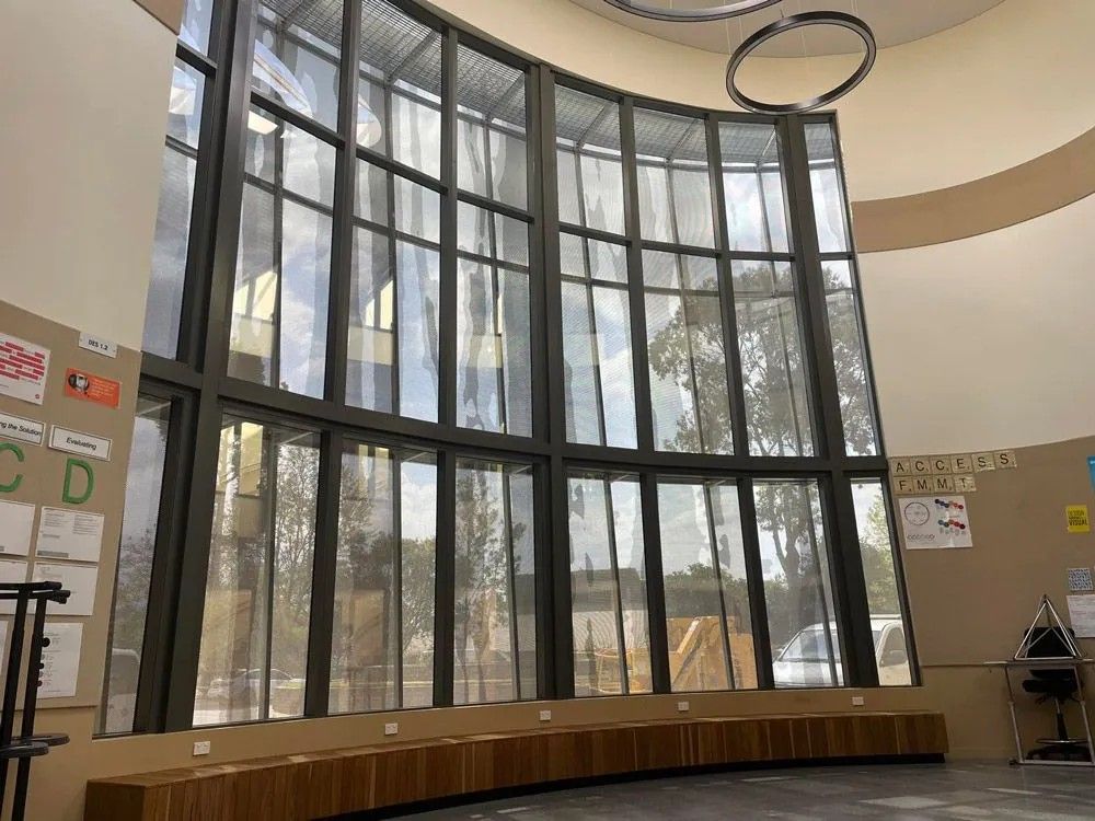 A Large Room with A Lot of Windows and A Wooden Bench — Solarmaster in Brisbane, QLD