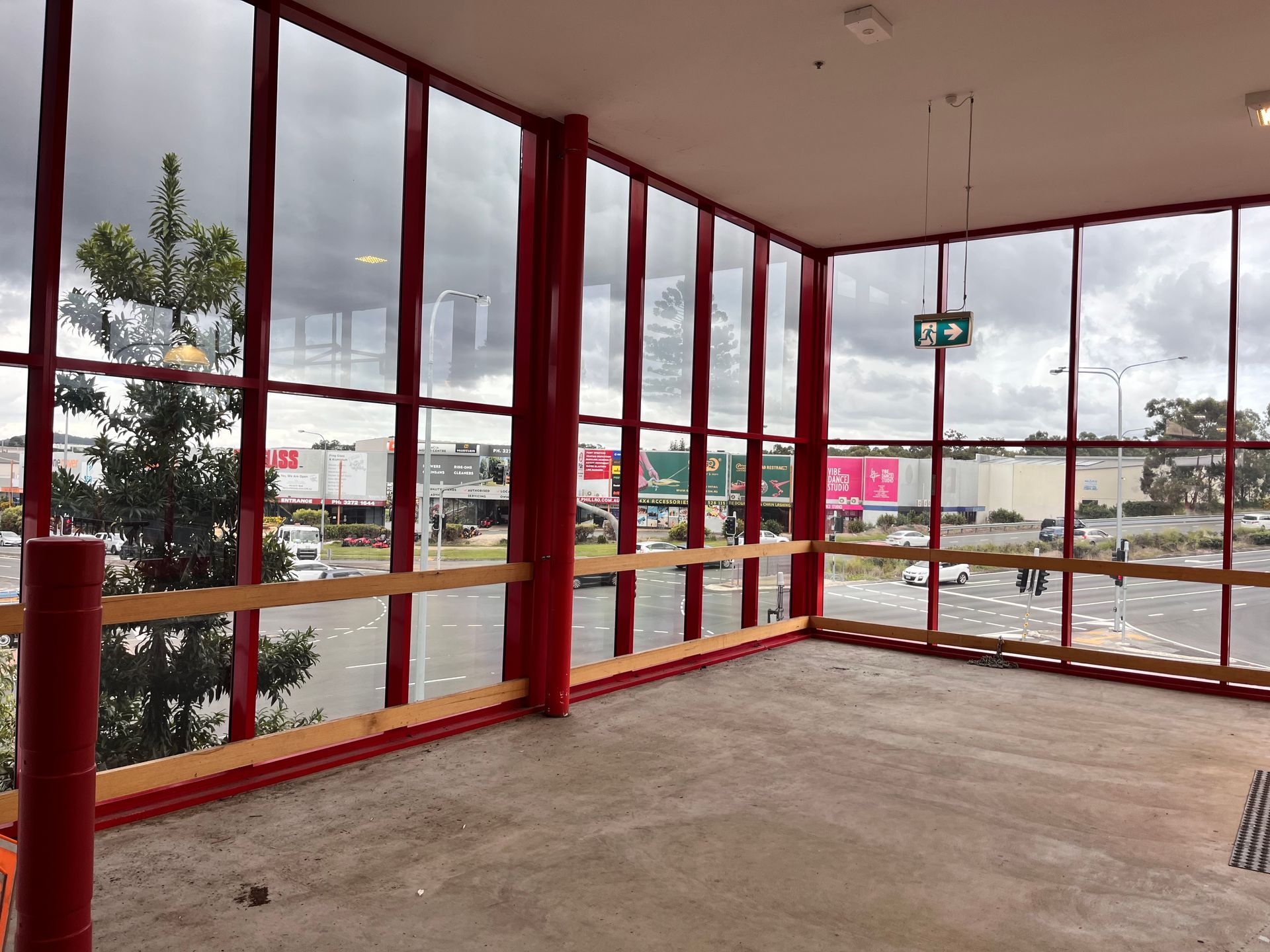 An Empty Room With a Lot of Windows and a Sign That Says Exit — Solarmaster in East Brisbane, QLD