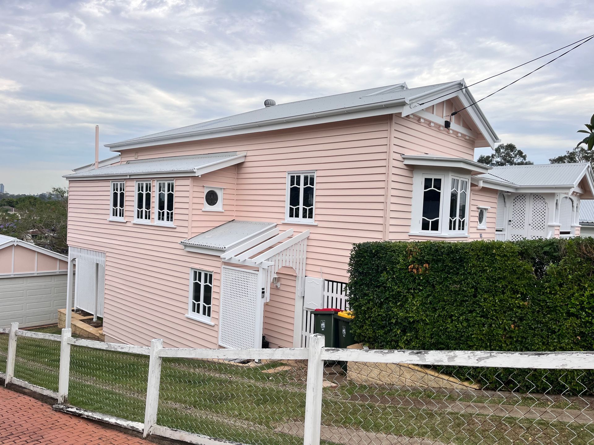 A Large Pink House with Tinted Windows — Solarmaster in Murarrie, QLD