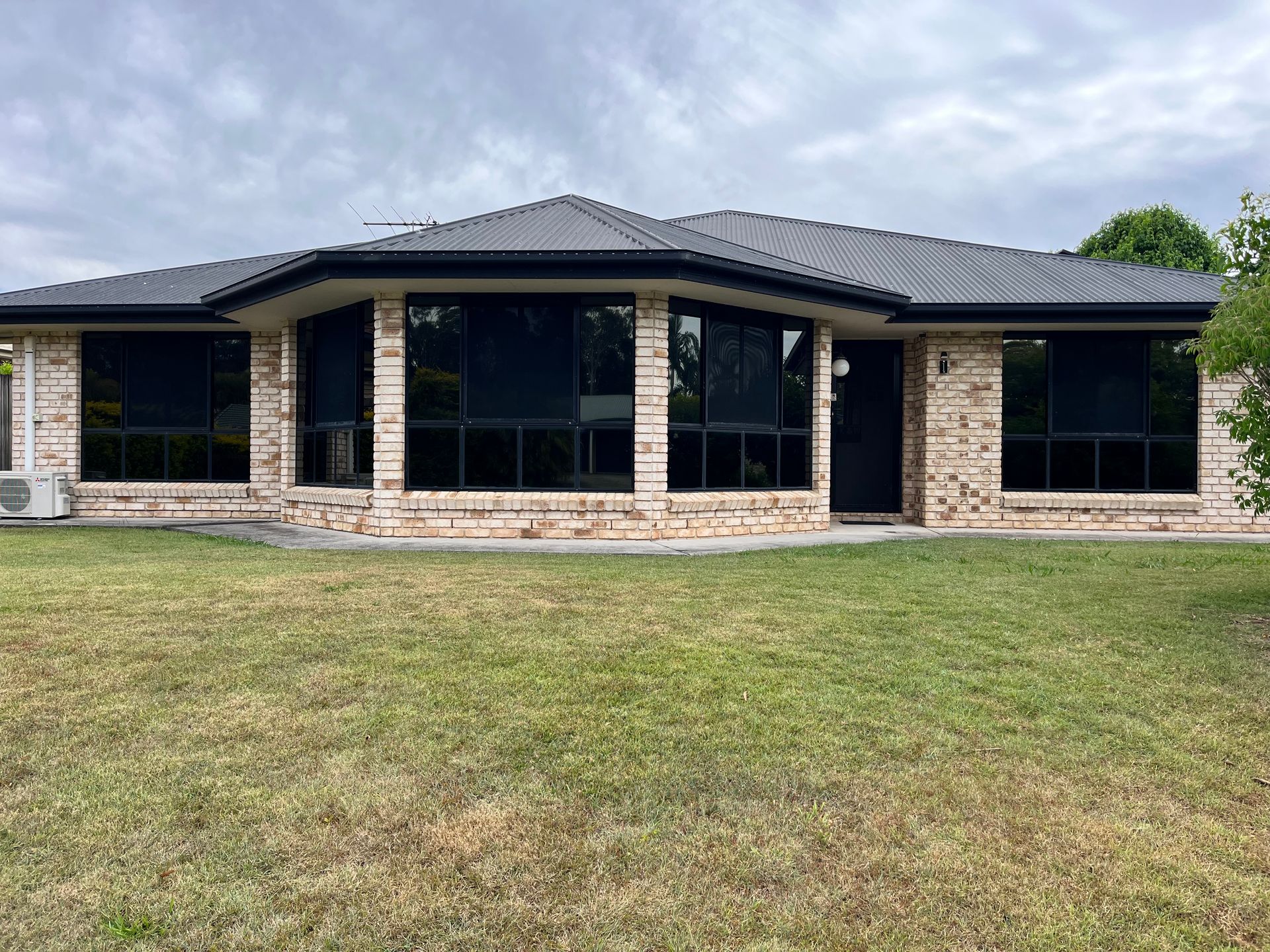 Single-story Brick House with Window Tinting