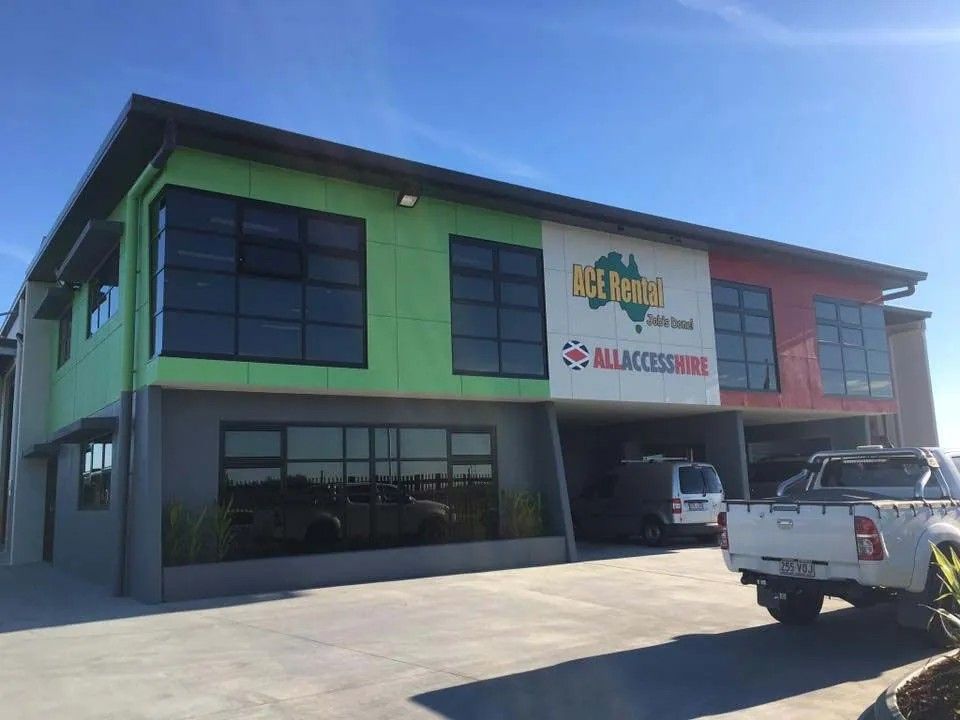 A White Truck Is Parked in Front of A Large Building — Solarmaster in Murarrie, QLD