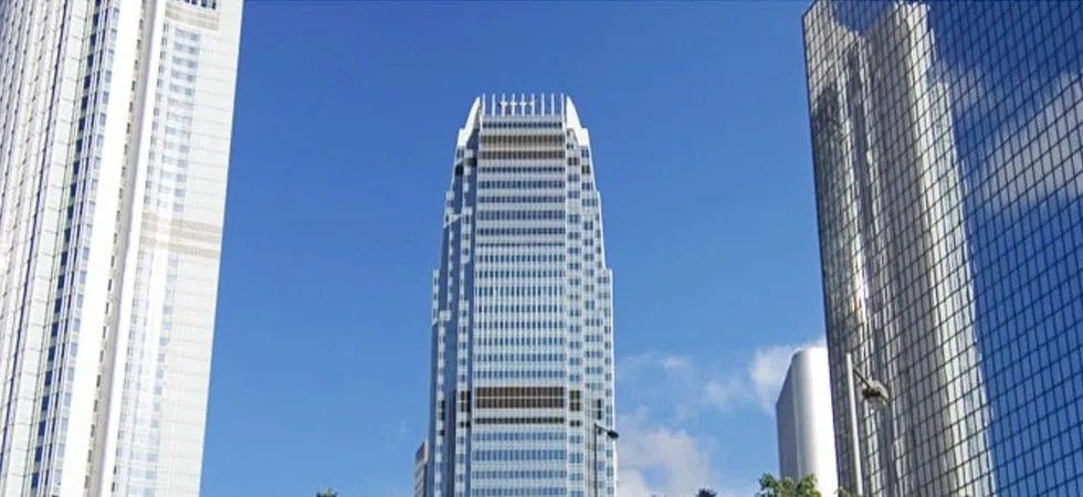 A Tall Building with A Blue Sky in The Background — Solarmaster in East Brisbane, QLD