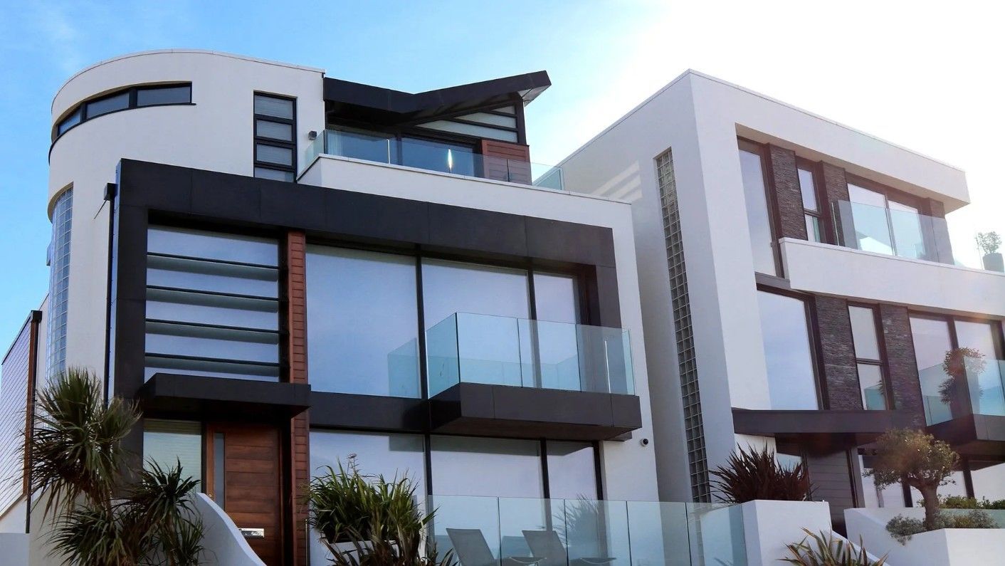 Modern White House With Dark Trim And Large Windows, Ocean View