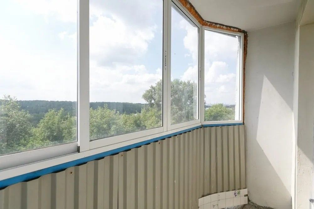 A Balcony with A Lot of Windows and A View of Trees — Solarmaster in Gold Coast, QLD