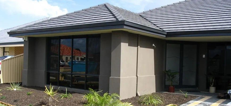 A House with A Gray Roof and A Lot of Windows — Solarmaster in East Brisbane, QLD