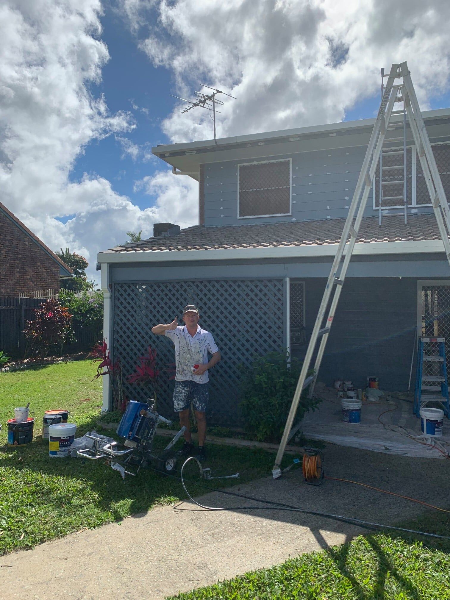 Painter with Thumbs up - painting Mackay