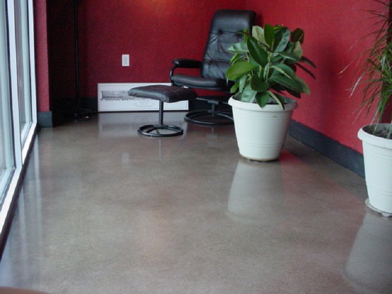 Polished concrete floor transitioning from green to orange.