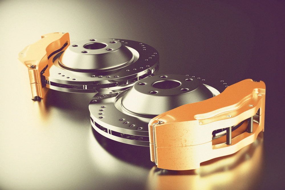 Close Up of a Pair of Brake Discs and Pads  — Townsville Car Audio Excellence in Townsville, QLD