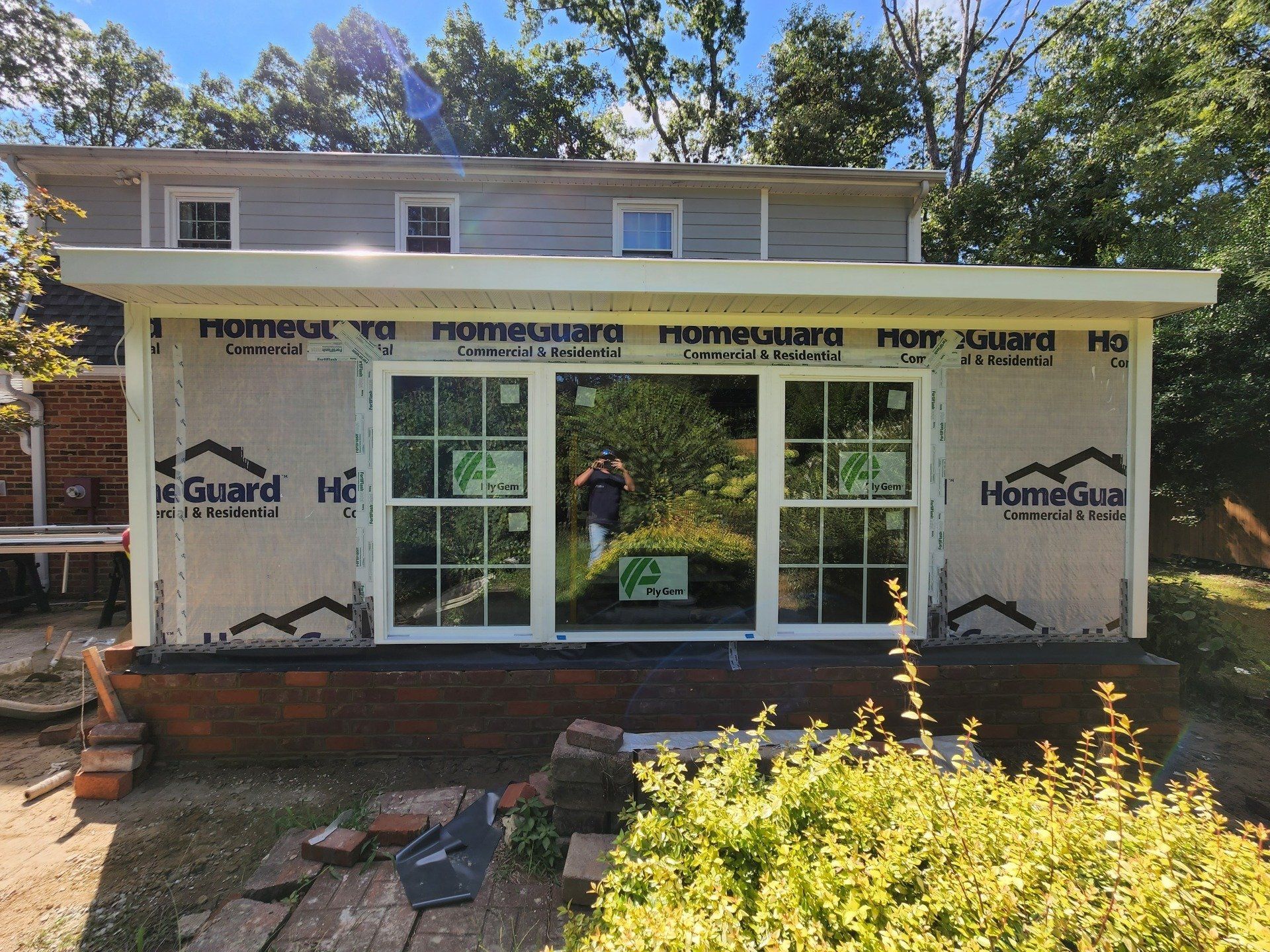 Installing  Glass Window — Chester, VA — ARW Contracting, Inc.