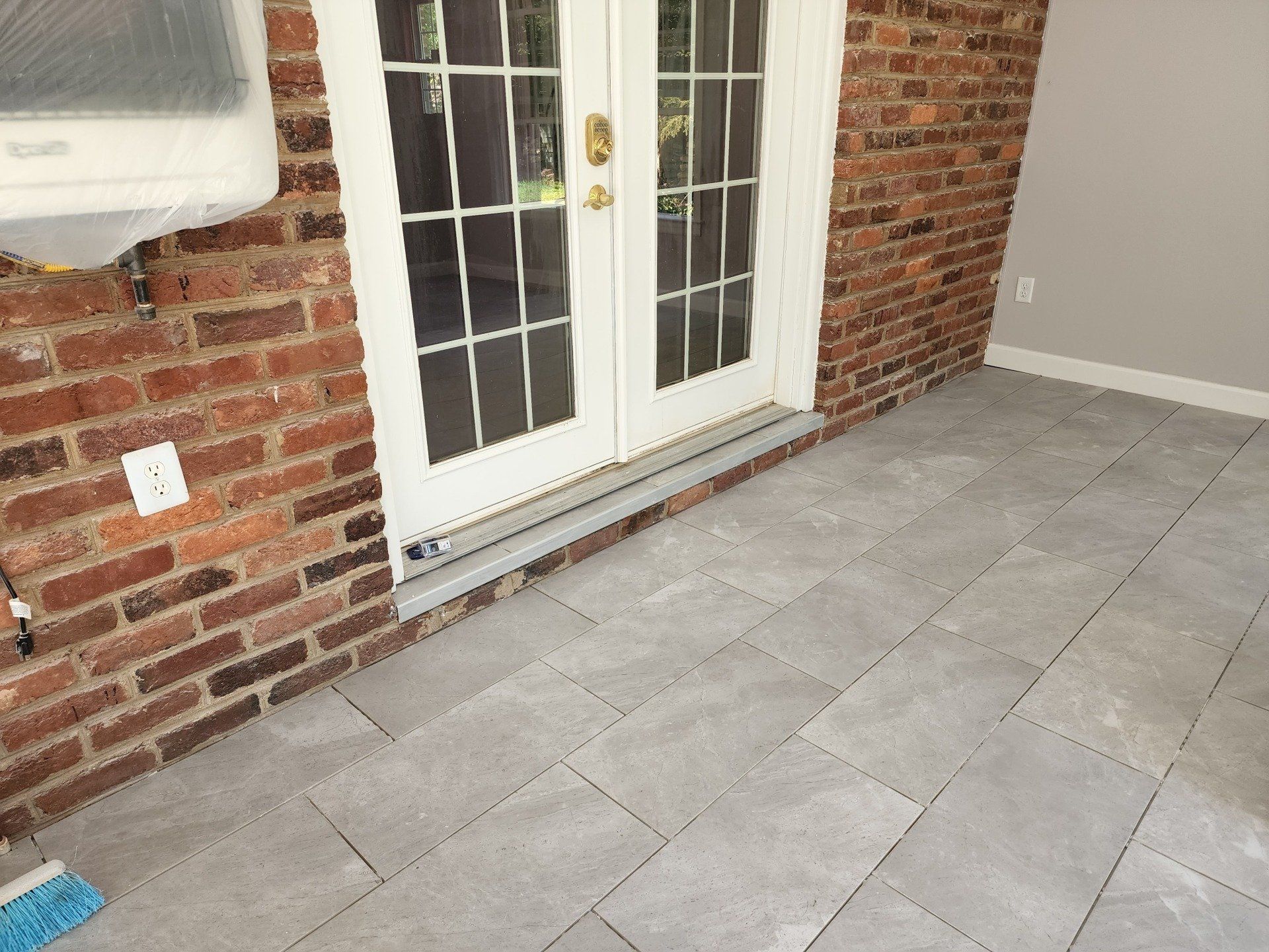 Installing Front Door With Bricks — Chester, VA — ARW Contracting, Inc.