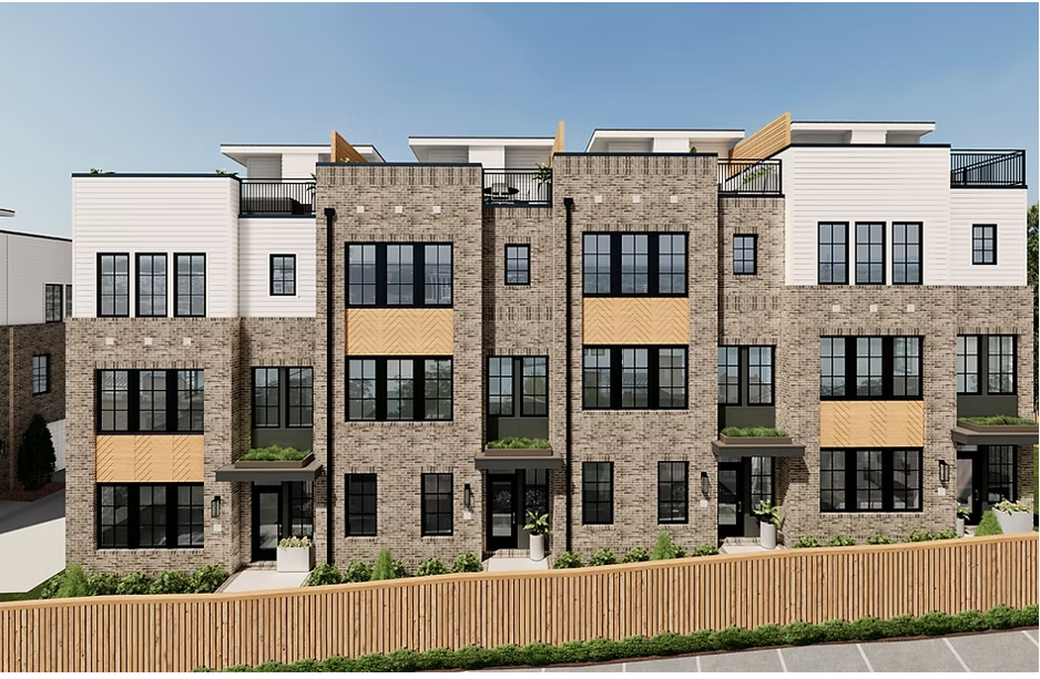 A rendering of a brick apartment building with a wooden fence in front of it.